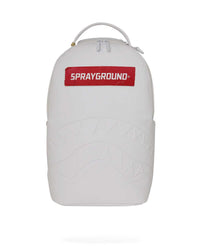 Sprayground Money Trick Backpack White, all-white backpack with embossed shark mouth and red Sprayground logo panel, front view