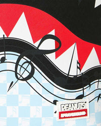 Sprayground Peanuts Snoopy Jams Backpack blue, close-up of the Peanuts and Sprayground logo tab