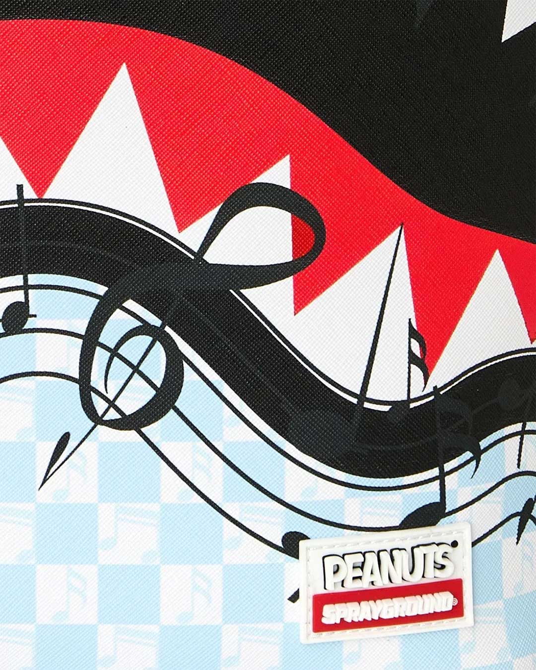 Sprayground Peanuts Snoopy Jams Backpack blue, close-up of the Peanuts and Sprayground logo tab