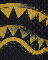 Sprayground Pyramid Stencil Shark Backpack Black, close-up of the pyramid texture and gold stencil