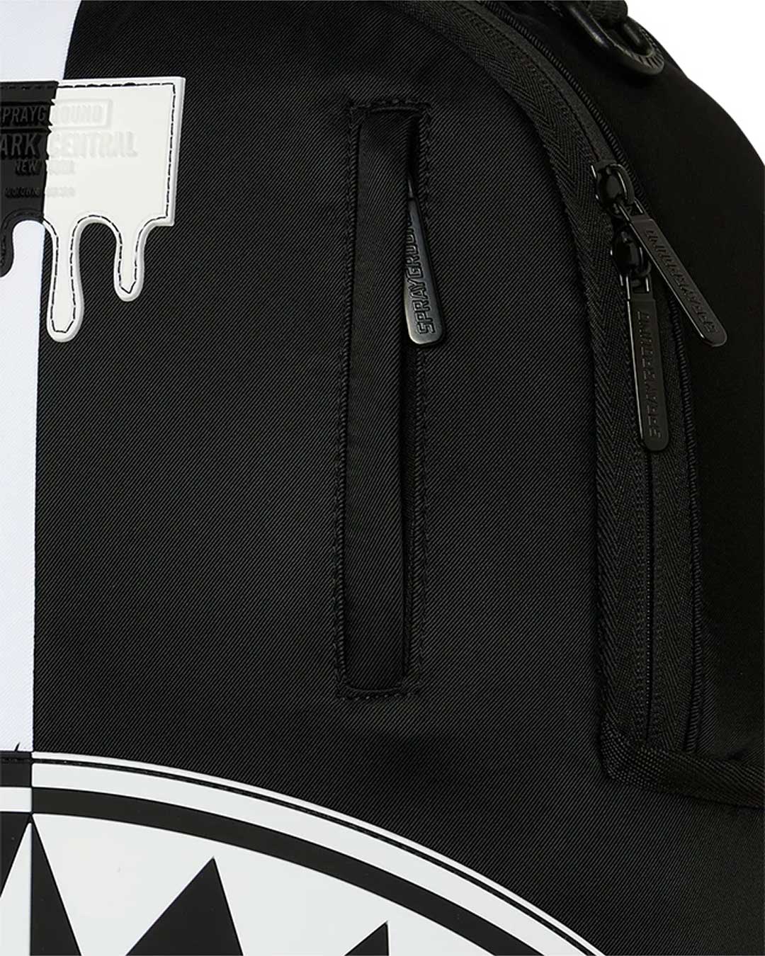 Sprayground Shark Central 2.0 Beyond Time Backpack, close-up of the drip logo patch