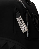 Sprayground Shark Central Printed Zip Backpack, close-up of the Shark Central Design Headquarters pull tag