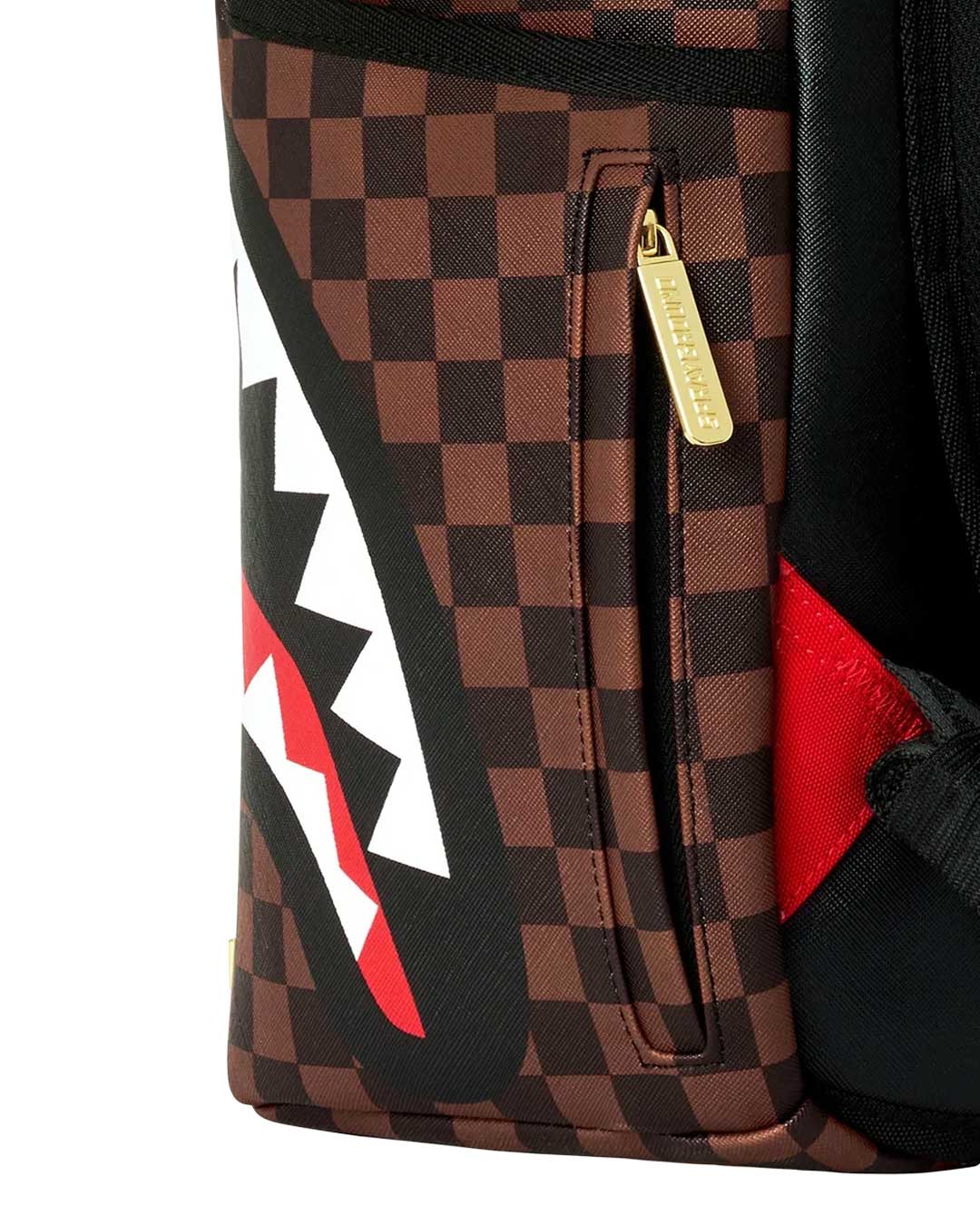 Sprayground Sharks In Paris Gold Drip DLXSV Backpack, corner detail of the checkerboard print