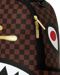 Sprayground Sharks In Paris Gold Drip DLXSV Backpack, close-up of the metallic gold drip detail