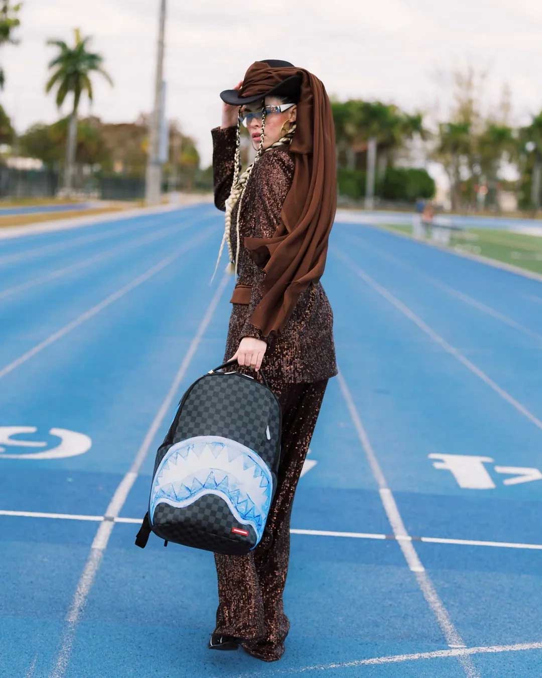 Sprayground Sharks On Iceberg Backpack, worn by a model