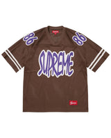 Supreme Reflective Football Jersey brown, mesh jersey with purple chenille Supreme lettering and 86 shoulder numbers, front view