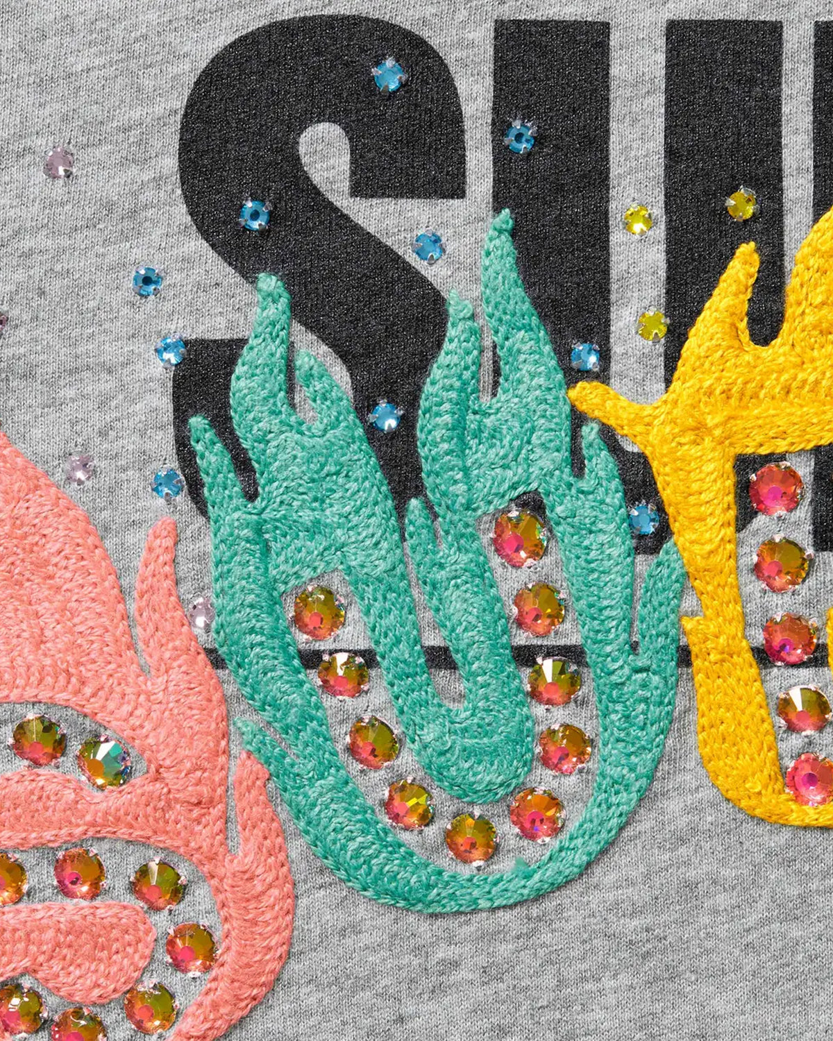 Supreme Undisputed S/S Top grey, close-up of the championship belt and New York graffiti print