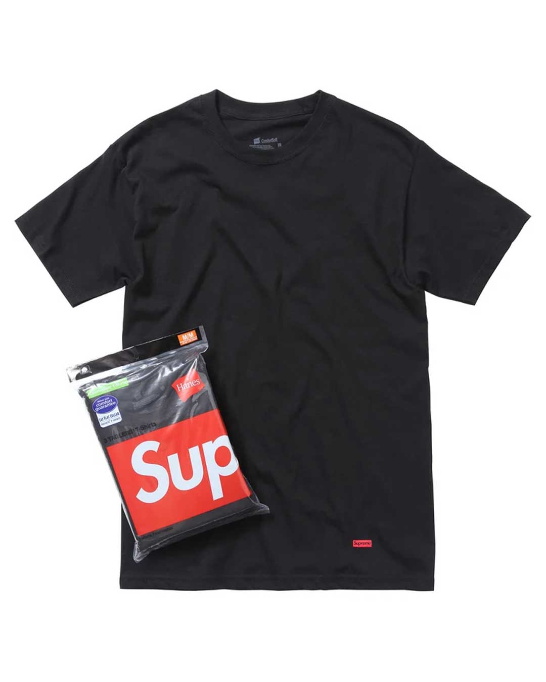 Supreme x Hanes Tagless Tee black 3 pack, plain black tee with red Supreme hem tab beside the retail pack, front view