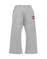 Triple Sevens Moto Sweatpants grey, back view with pink and red logo on the right leg
