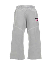 Triple Sevens Moto Sweatpants grey, back view with pink and red logo on the right leg