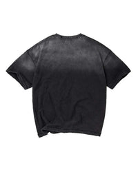 A faded black short-sleeve t-shirt with a washed, mineral-wash texture, shown from the back against a plain white background.
