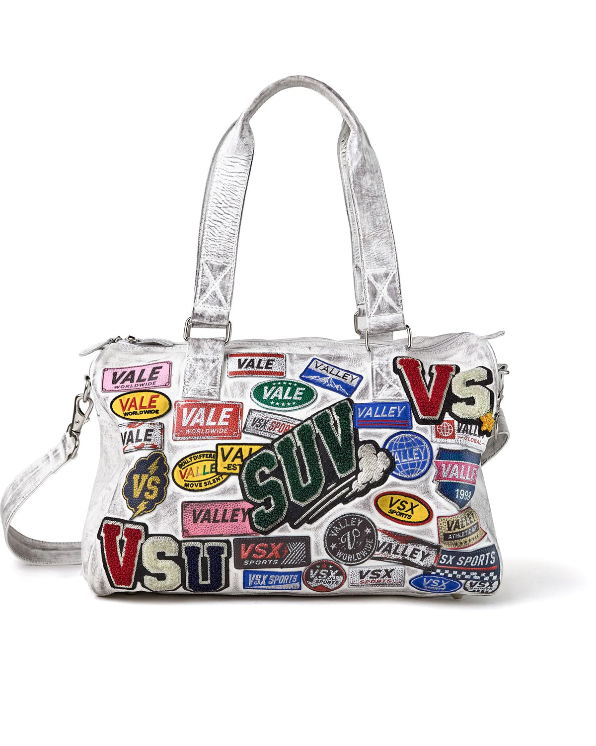 Vale Forever Airport Duffle Bag white, patch-covered duffle with silver metallic handles, front view