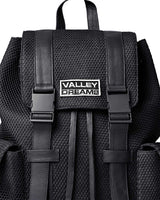Vale Forever Black Ops Backpack black, close-up of the Valley Dreams metal plate and buckled straps