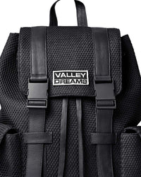 Vale Forever Black Ops Backpack black, close-up of the Valley Dreams metal plate and buckled straps