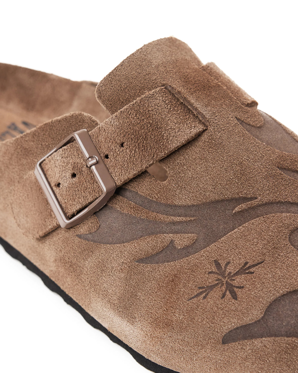 Vale Forever Chocolate Clogs brown, close-up of the metal buckle strap and flame print on the suede upper