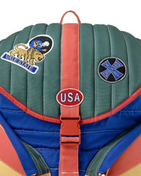 Vale Forever Diegos Backpack multicolor, close-up of the quilted flap, patches and USA buckle plate