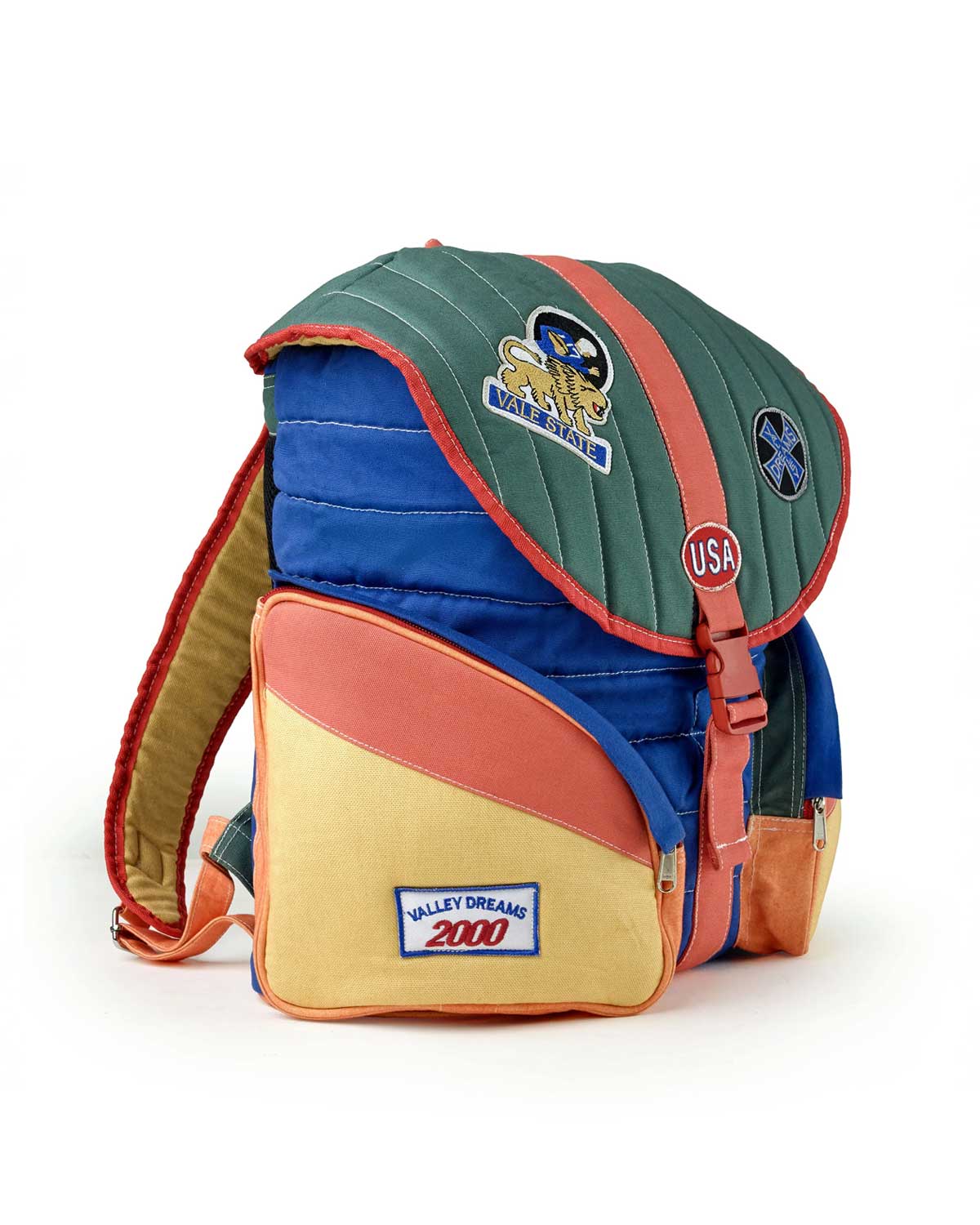Vale Forever Diegos Backpack multicolor, side view showing the yellow pocket with Valley Dreams 2000 label