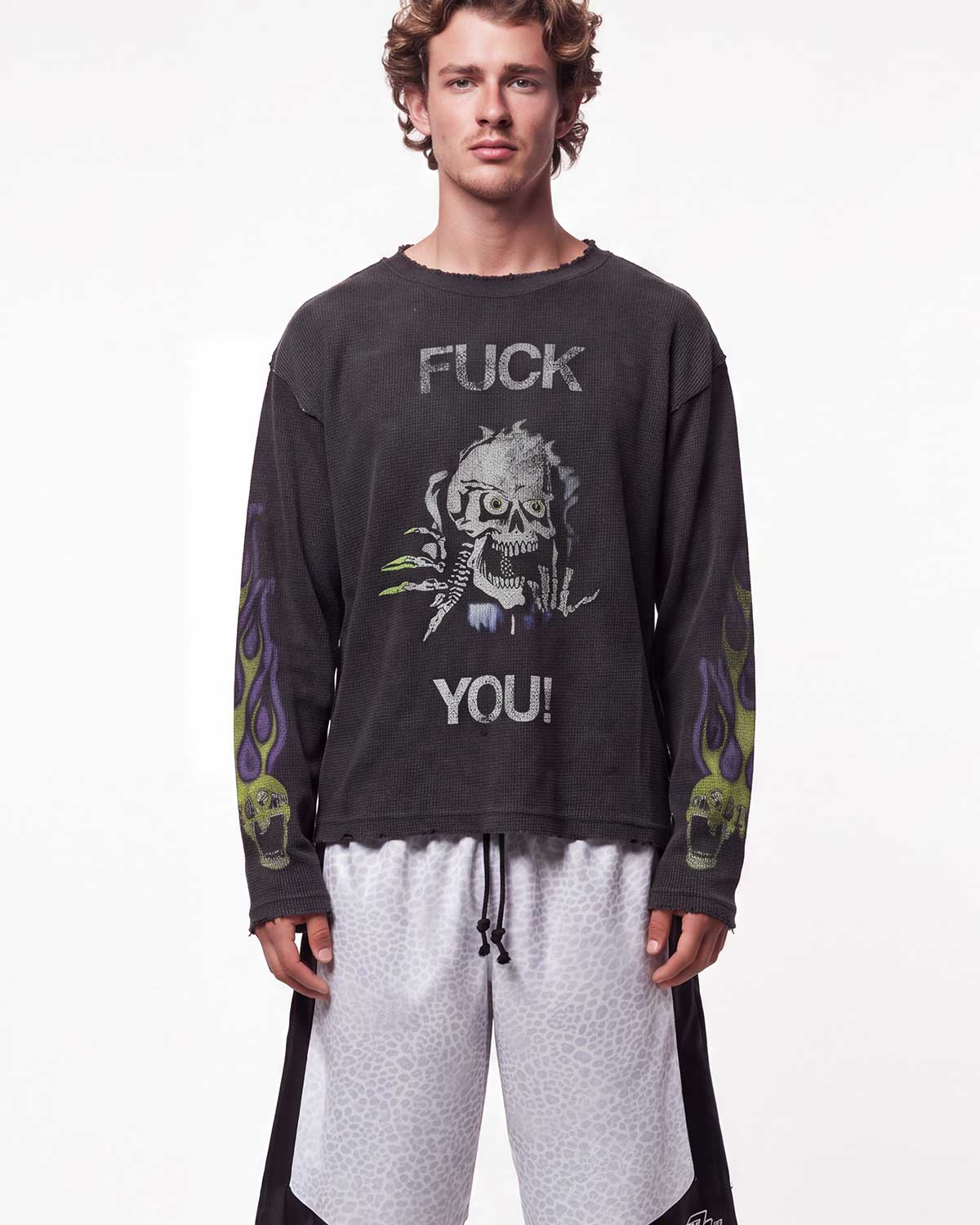 Vale Forever F**k You Thermal black, upper body front view on model showing the stacked skull graphic and flame sleeves