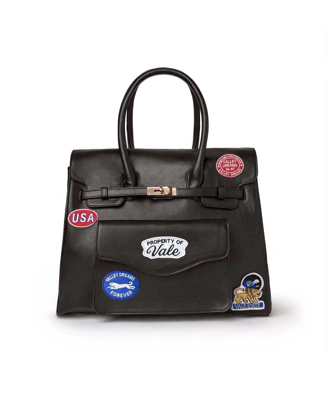 Vale Forever Lucky Charms Bag brown, structured leather top-handle bag with USA and Property of Vale patches, front view