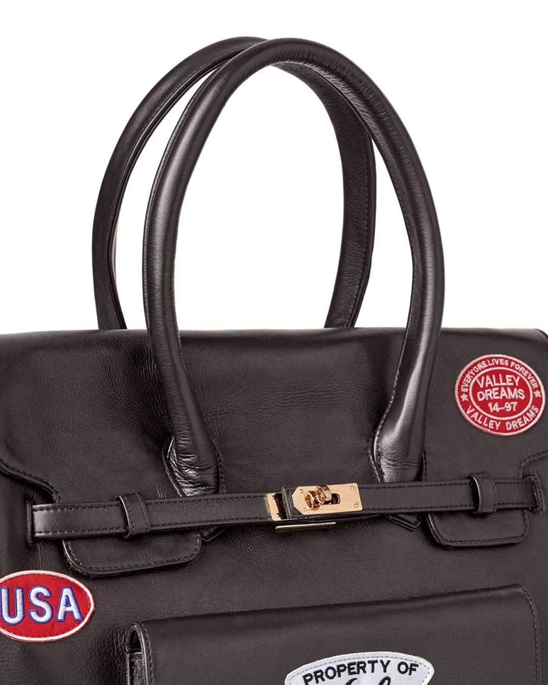 Vale Forever Lucky Charms Bag brown, close-up of the rolled leather handles and gold turn-lock strap closure