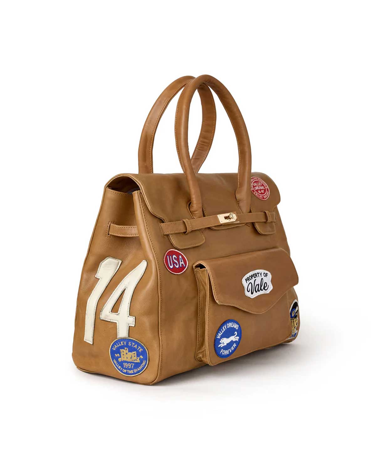 Vale Forever Lucky Charms Bag tan, three-quarter view showing the white appliqué 14 and Valley State 1997 roundel on the side panel