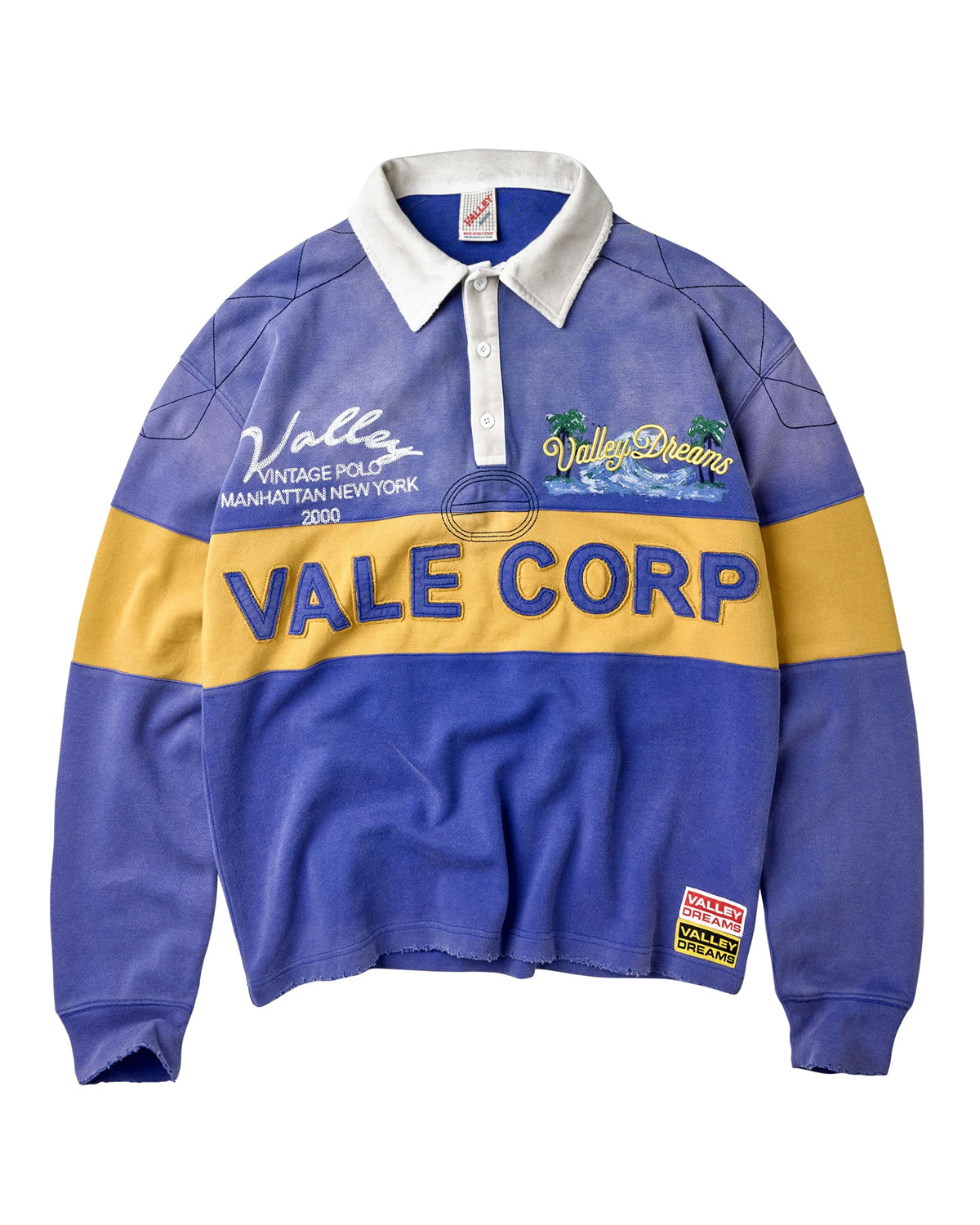 Vale Forever Vale Corp Rugby blue, long-sleeve rugby shirt with white collar and gold Vale Corp stripe, front view