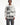 A model wearing a white long-sleeve crewneck sweatshirt with a large black and white graphic print on the front and 'Valley' text on the sleeves, paired with dark distressed pants against a plain white background.