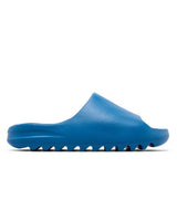 Yeezy YS-01 Slides blue, royal blue one-piece foam slide with ridged outsole, side view