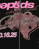 Sp5der Rodeo Texas Zip Up Hoodie black, close-up of the pink Sp5der lettering, rhinestone Rodeo script and 10.16.25 date